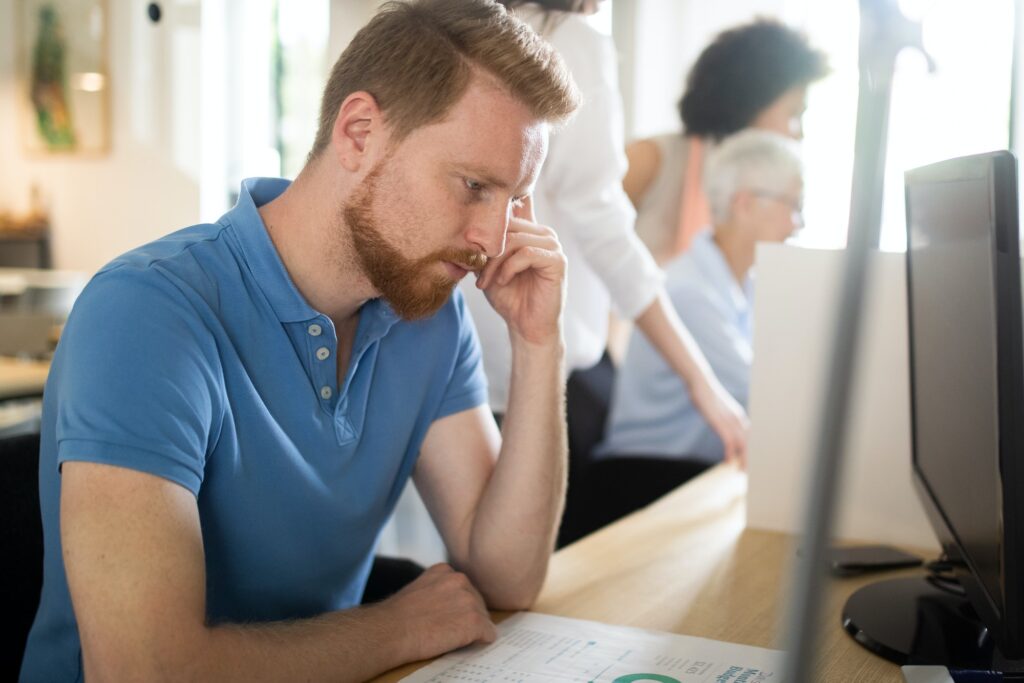 Frustrated stressed business man in an office