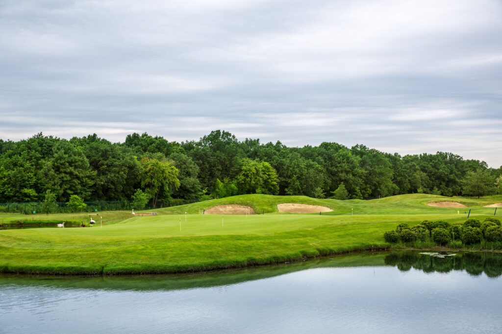 Mirror lake, lawn for golfing on golf course